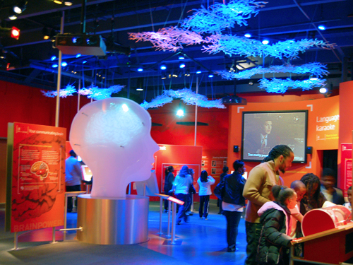 Visitors explore the colorful Communication exhibit at Liberty Science Center, Jersey City
