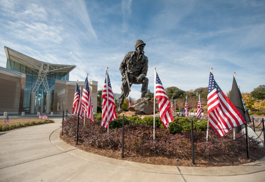 The Iron Mike statue in front of the Airborne and Special Operations Museum in Fayetteville, N.C. is decorated for Veterans Day, Nov. 9, 2013. The parade featured Soldiers from the U.S. Army Reserve Command headquarters, the 82nd Airborne Division, high school Junior ROTC, high school marching bands and veterans from past wars. (U.S. Army photo by Timothy L. Hale/Released)